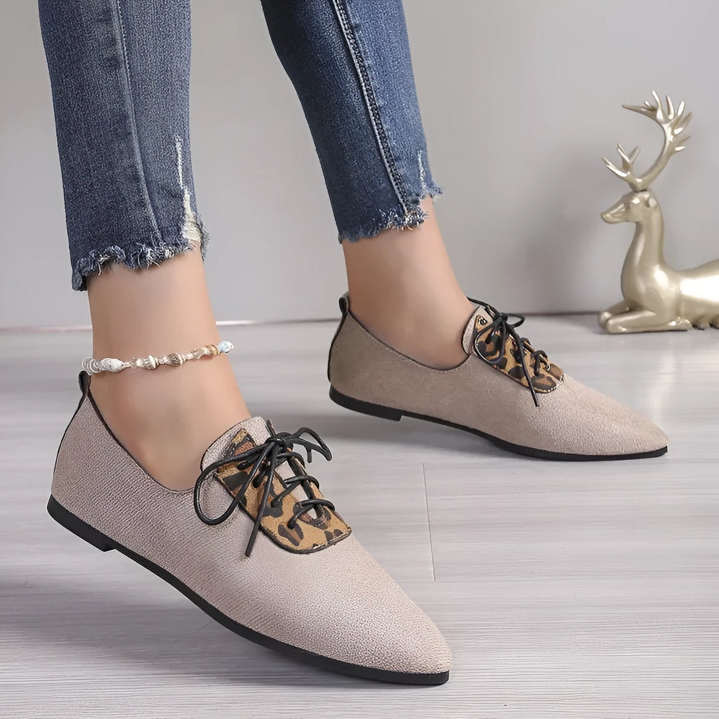 Beige leopard print women's pumps with pointed toe design and rubber sole