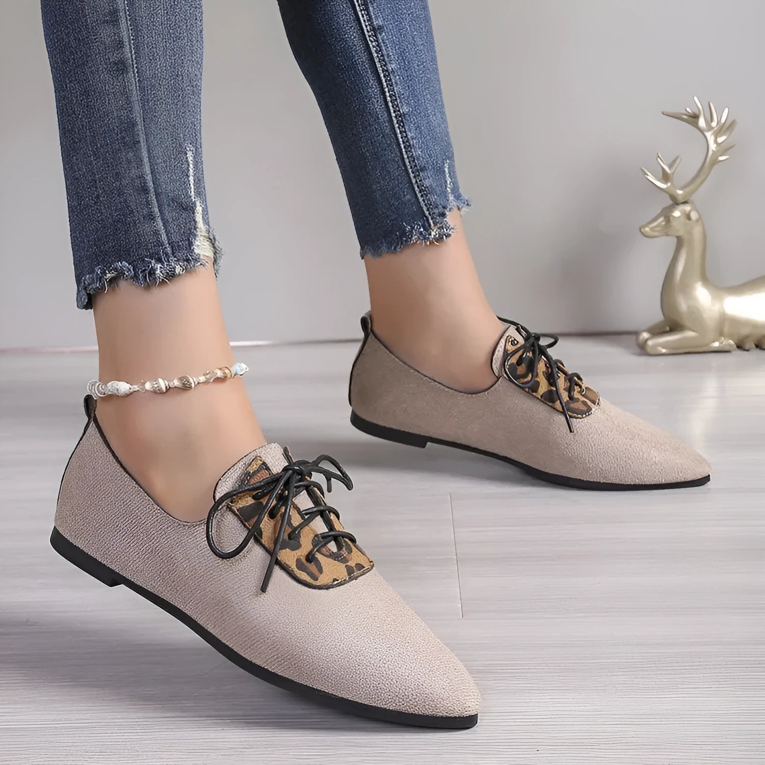 Beige leopard print women's pumps with pointed toe design and rubber sole