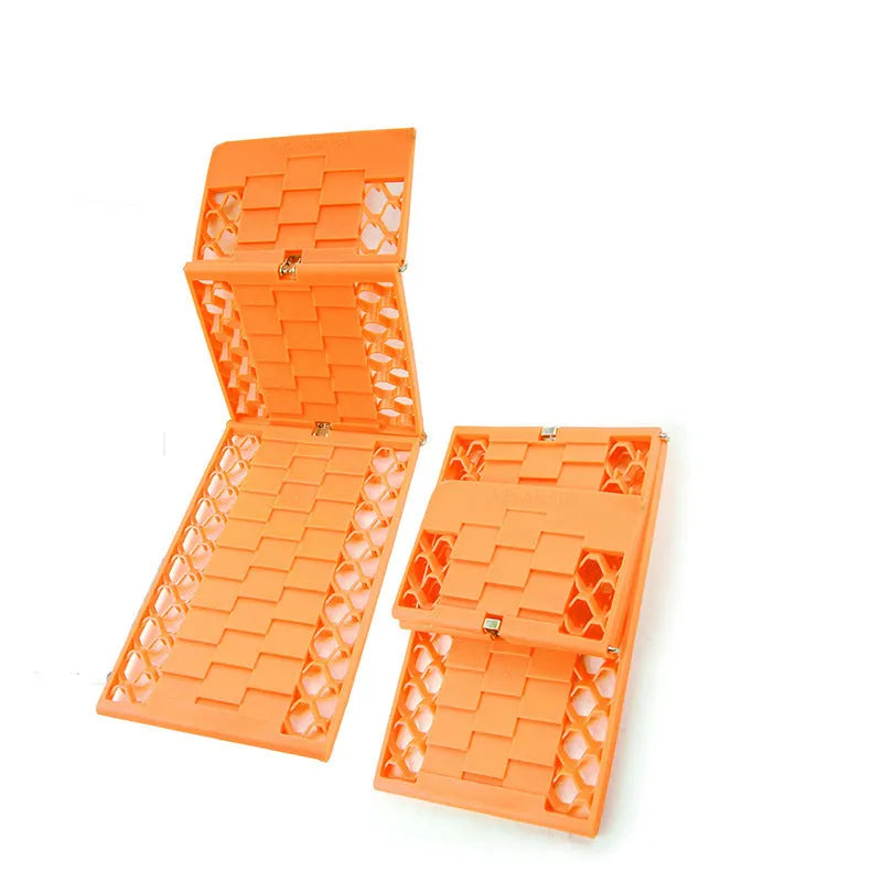 Pair of orange folding anti-slip car rescue boards for snow and mud recovery