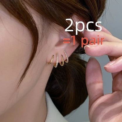 Elegant silver-tone zircon stud earrings with a sleek and sophisticated design