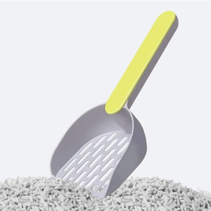 Blue plastic cat litter shovel scoop with drainage holes for cleaning a litter box.