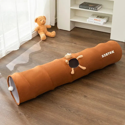 Collapsible brown or grey cat tunnel with a plush ball on top, shown in both extended and folded flat positions.