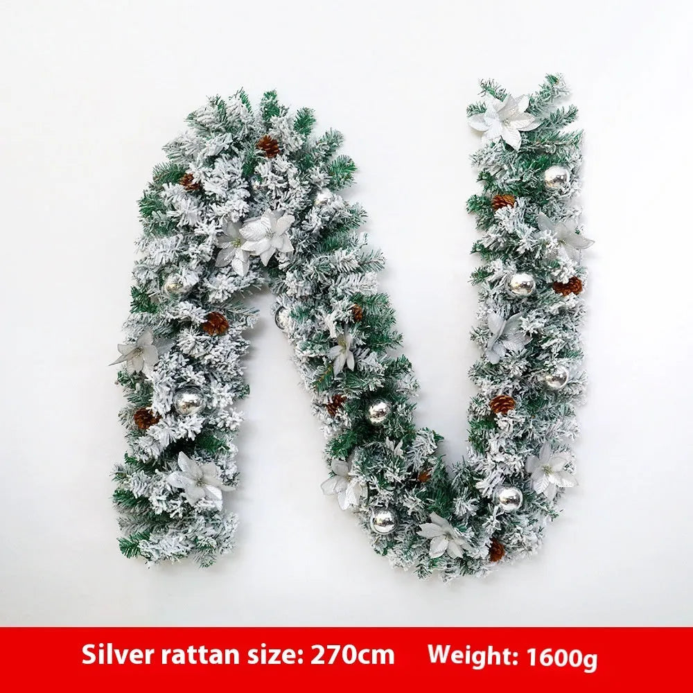 PVC Christmas rattan garland with flocked decoration in golden colour, draped as a festive vine.