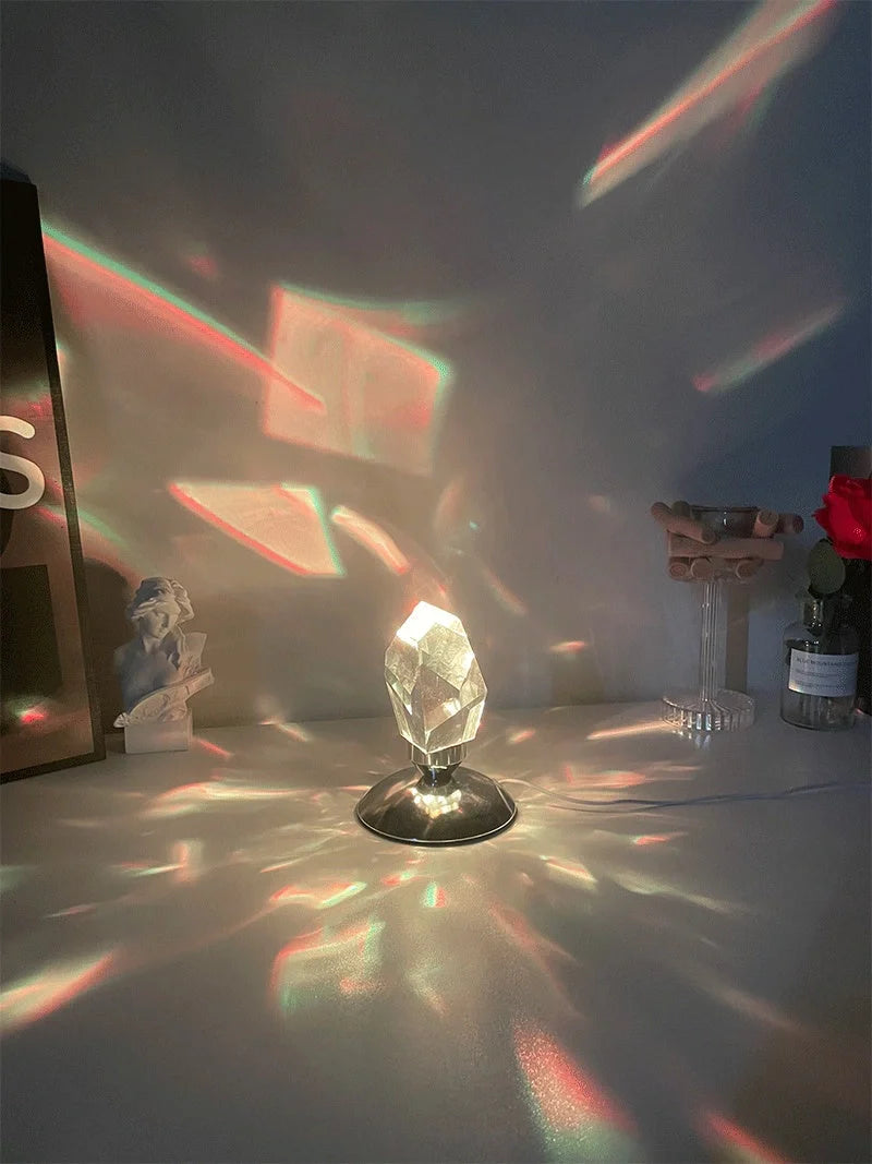 LED Crystal Night Light with remote control and 16 color options on a bedside table