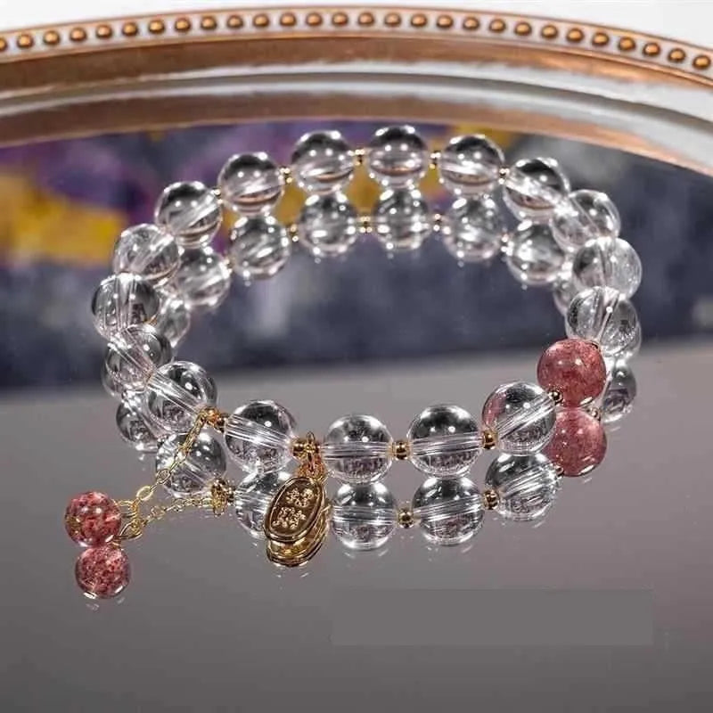 Handmade white crystal bracelet with 8mm beads and U-shaped design on wrist