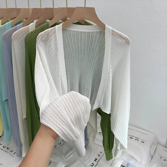 Long sleeve polyester blouse with lantern sleeves and hollow detail in apricot colour.