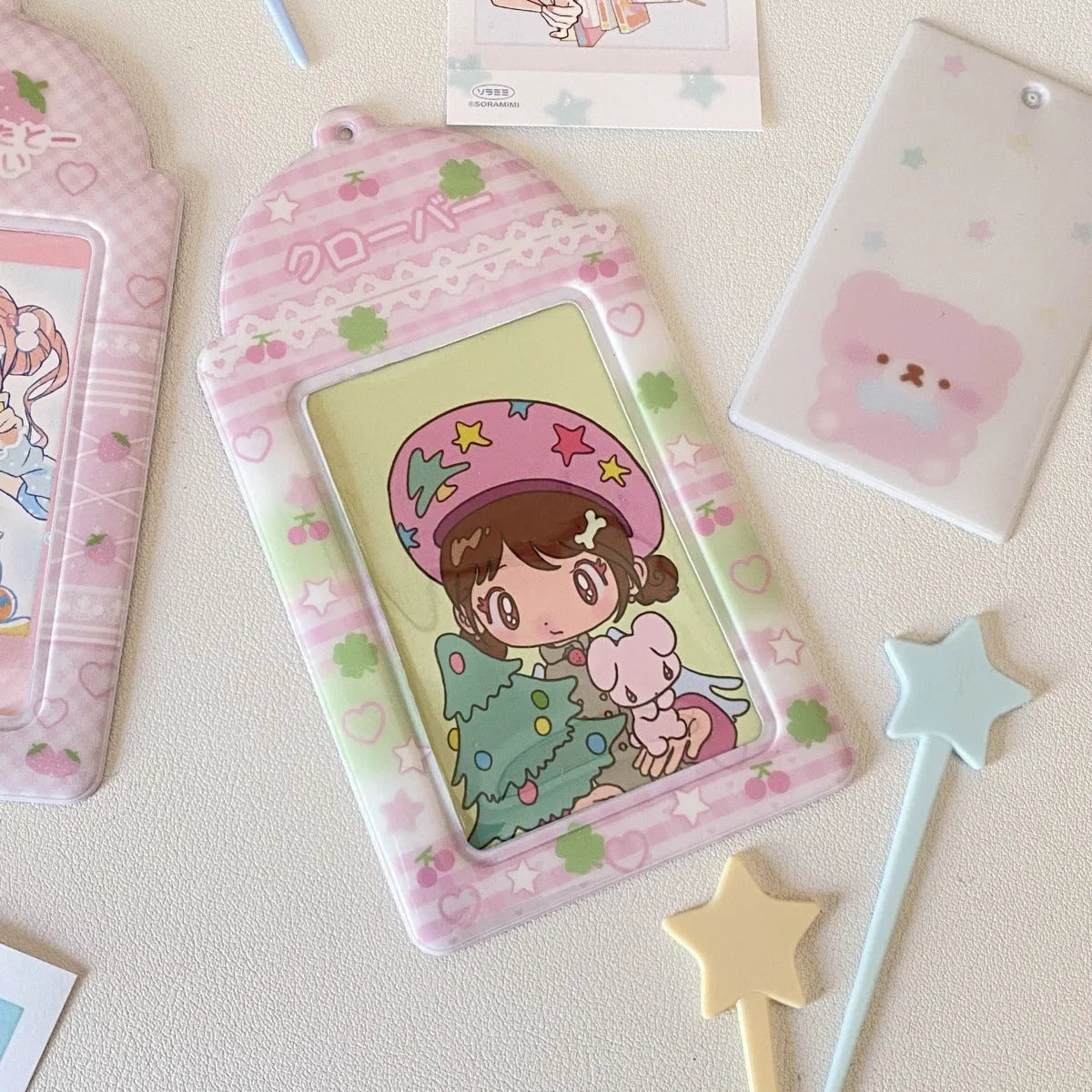 Cartoon plaid strawberry PVC card holder measuring 7.6 by 13.6 centimetres with lanyard attachment