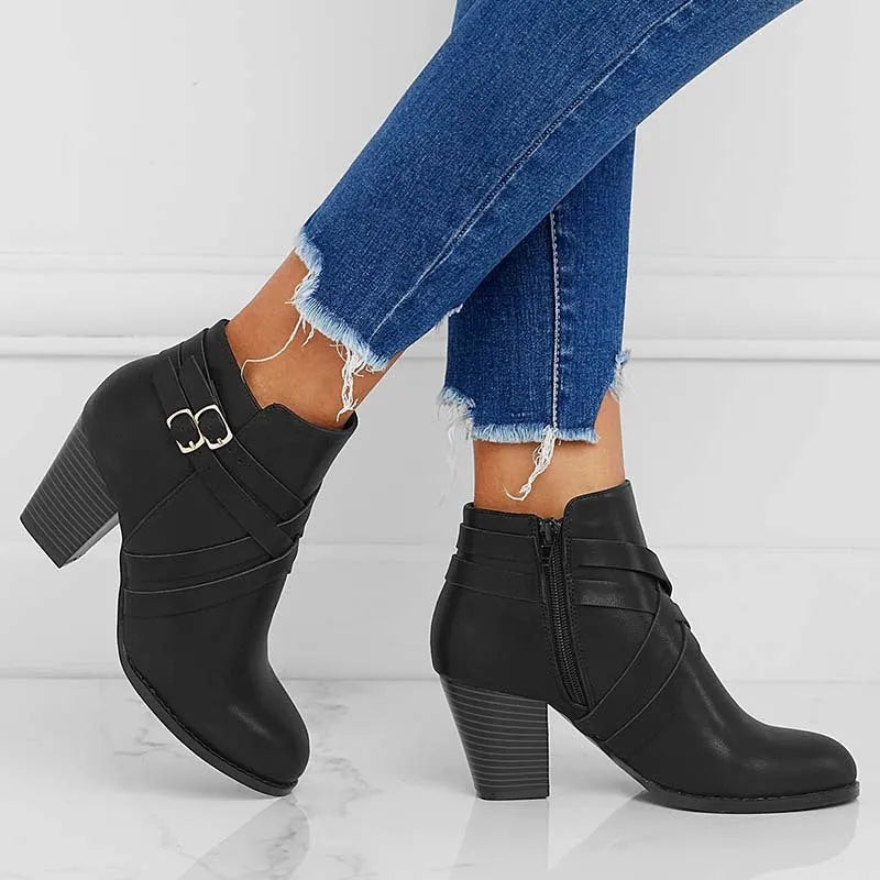 Women's plus size black PU leather short ankle boots with a 7cm heel and side zipper.
