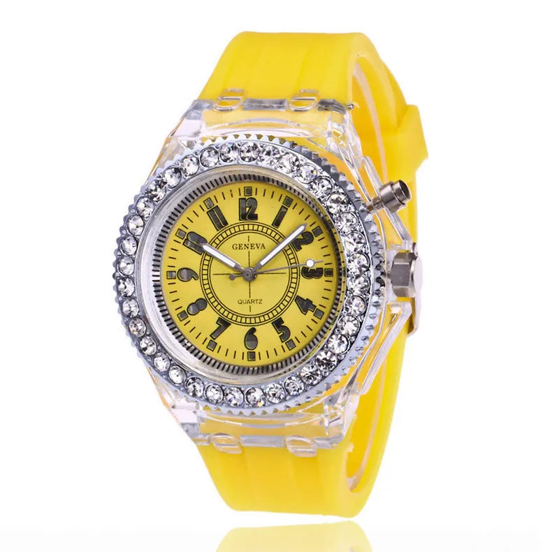 Women's LED luminous quartz watch with silicone strap and round alloy case on wrist