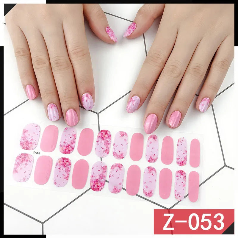 Korean nail stickers sheet showing cartoon, flower, and strawberry patterns with a nail file.
