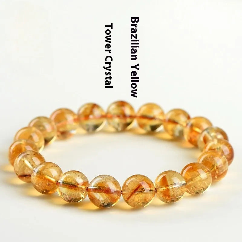 Natural yellow citrine bracelet with geometric beads in various sizes from 4mm to 20.8mm diameter on wrist