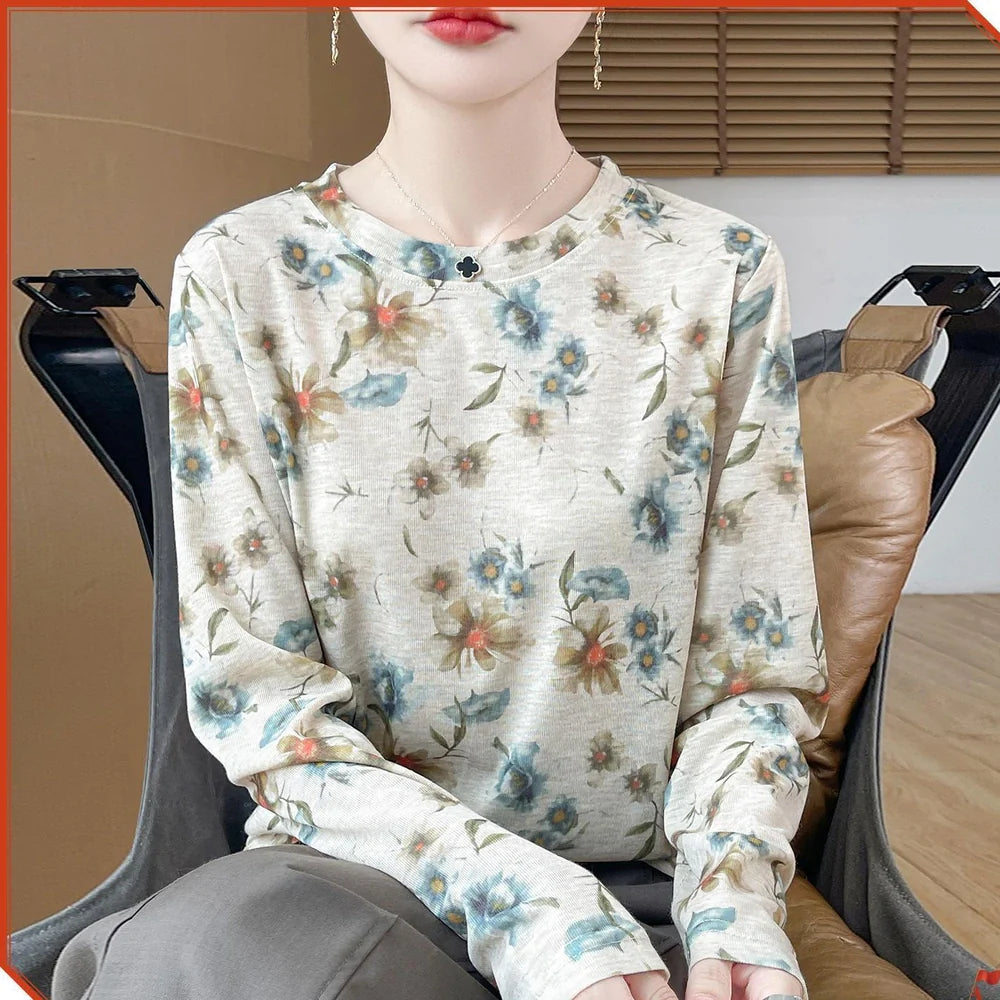 Round neck floral print pullover shirt in Tencel cotton blend fabric on hanger
