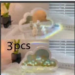 DIY tulip-shaped night lamp kit with LED lights and mirror surface in assorted colours on a desk.
