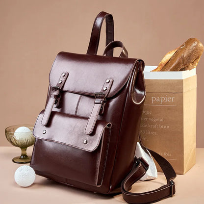 Genuine cowhide leather backpack for women in black, brown, or coffee, showing hard-textured two-layer construction.