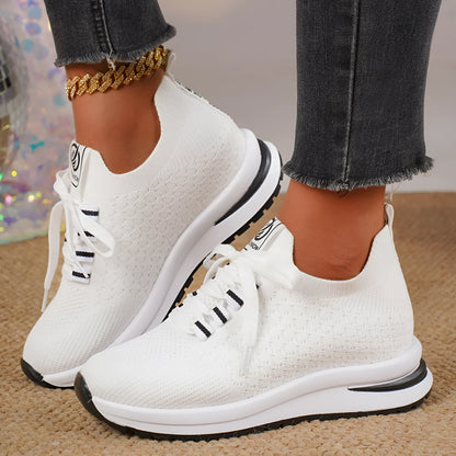 Women's black mesh lace-up platform sneakers with a round toe and flat rubber sole on a white background.
