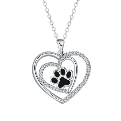 Copper heart pendant necklace with engraved dog paw print on a cross chain.