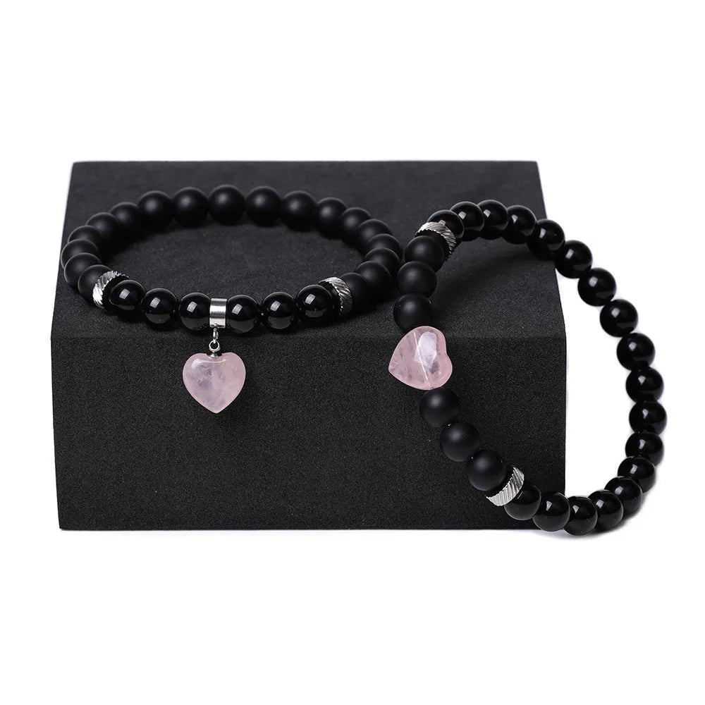 Matching couple bracelets with polished natural stone heart pendants in geometric style