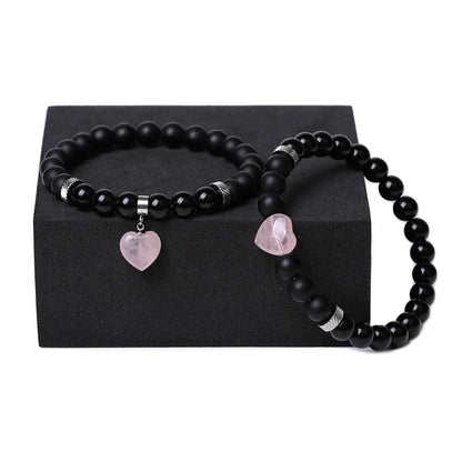 Matching couple bracelets with polished natural stone heart pendants in geometric style