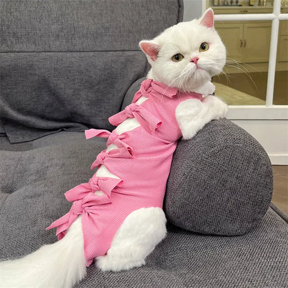 Lace-up cat sterilisation clothing in five colours including pink, purple, blue, brown, and green pineapple, showing adjustable fastening