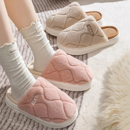 Cozy plush slippers in various colors, including light gray, khaki, yellow, and pink, with a soft plush upper and durable PVC sole for indoor and outdoor use.