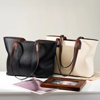 Women's genuine leather large capacity crossbody commuter bag in black, shown with internal organised compartments.