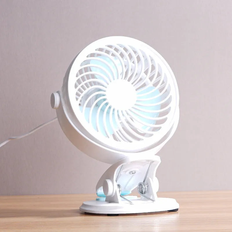 USB-powered desk fan with clip attachment, three blades, and mechanical speed control, measuring 19cm wide