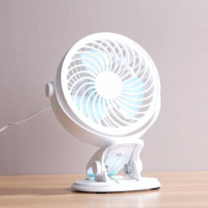 USB-powered desk fan with clip attachment, three blades, and mechanical speed control, measuring 19cm wide