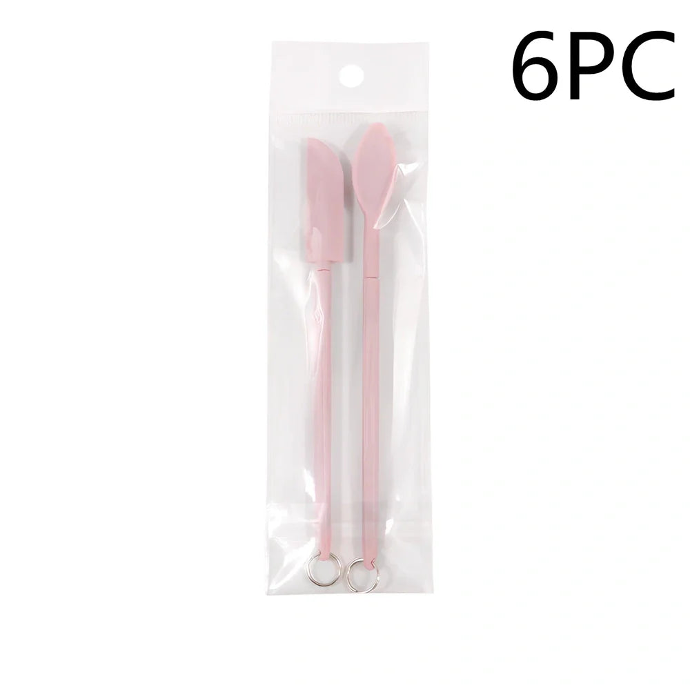Retractable silicone cosmetic spatula extended to 15cm with scraper tool for product application