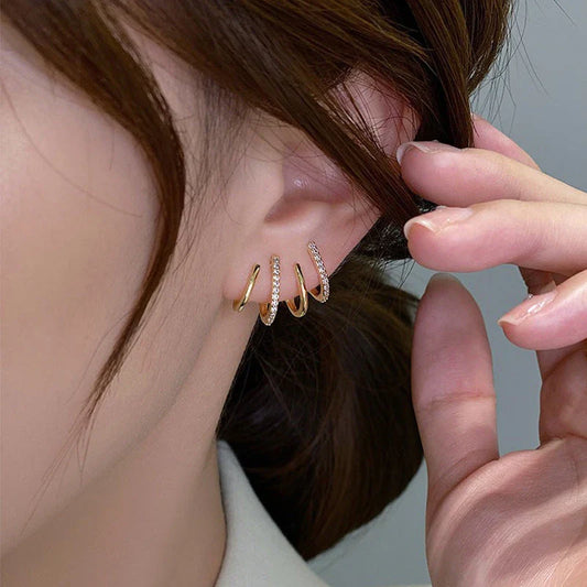 Elegant silver-tone zircon stud earrings with a sleek and sophisticated design