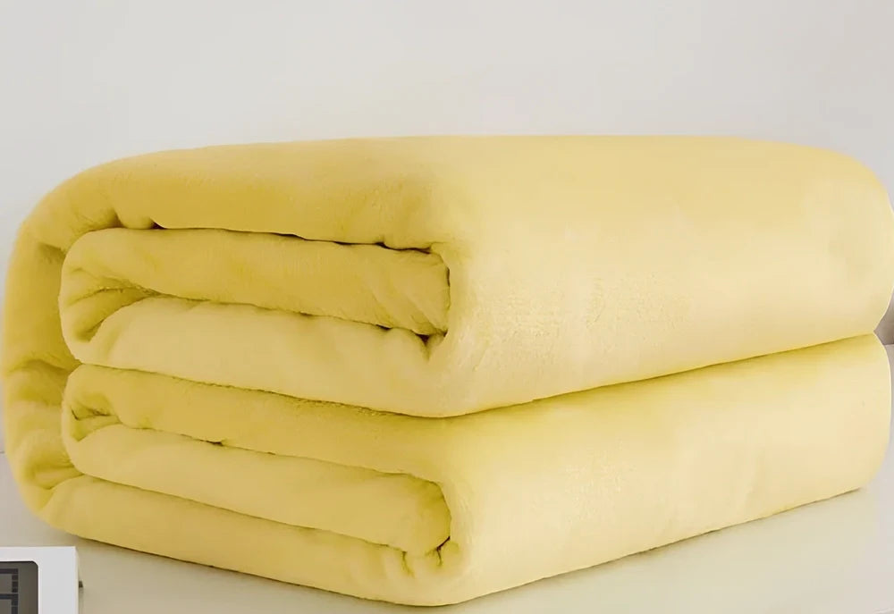 Coral fleece flannel blanket in beige showing textured surface and consistent edges