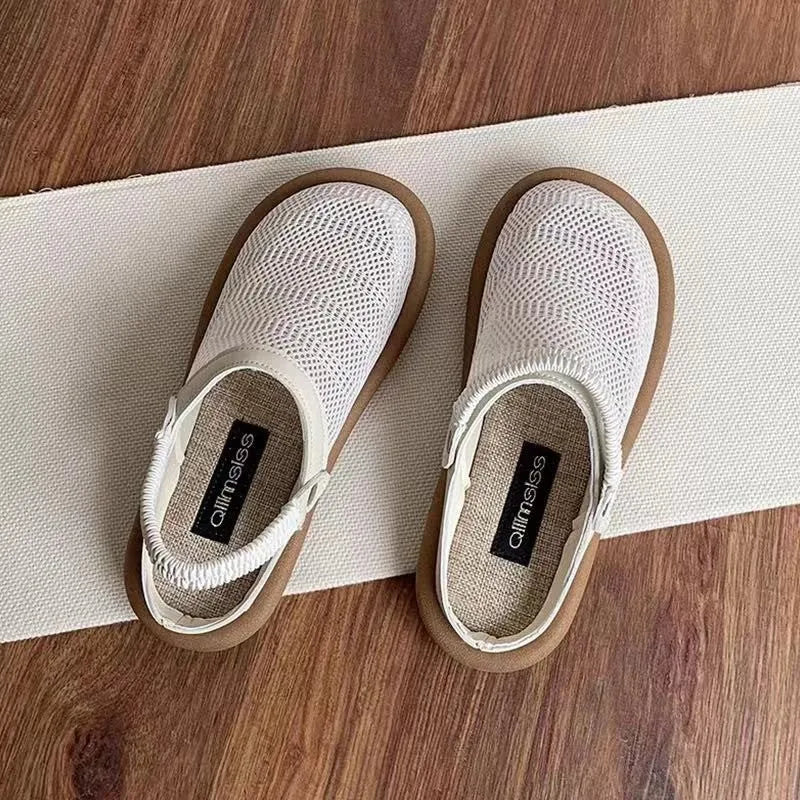 Women's beige linen slip-on shoes with mesh lining and a soft rubber sole.