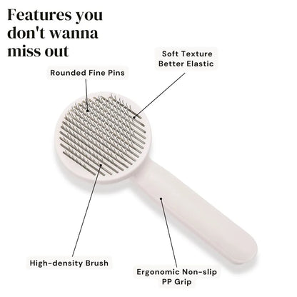 Blue self-cleaning pet grooming brush with stainless steel pins and ergonomic rubber handle on a grey background