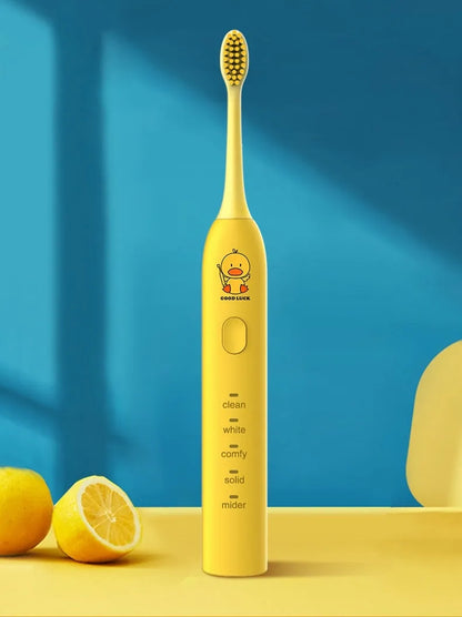Yellow rechargeable electric toothbrush with small duck design, soft bristles and USB charging cable