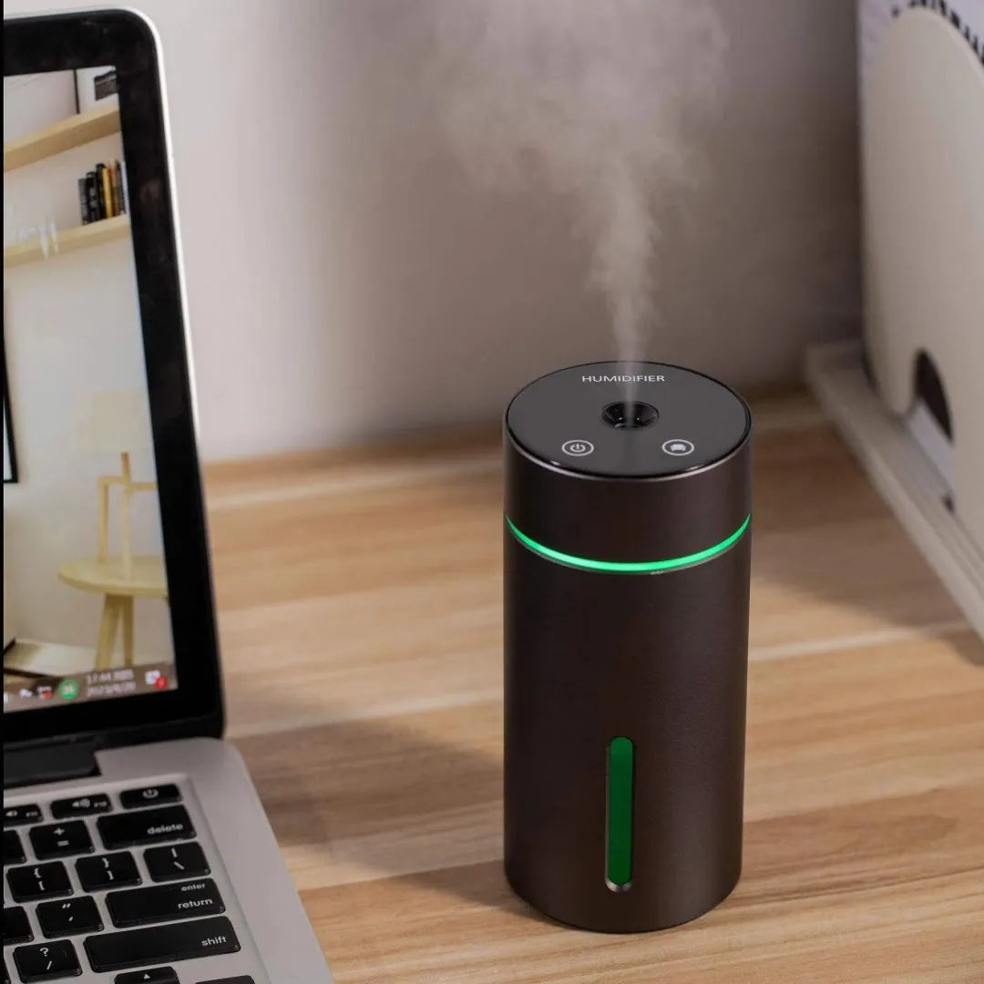 Black aluminium portable car humidifier and essential oil diffuser with night light on desk