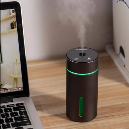 Black aluminium portable car humidifier and essential oil diffuser with night light on desk