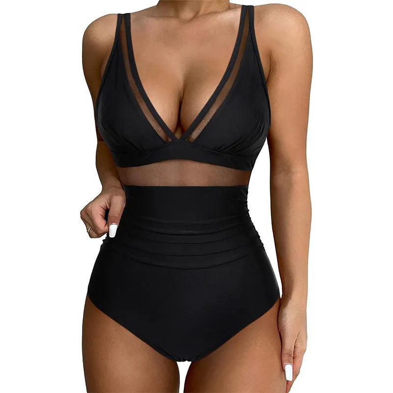 Black halter neck one-piece swimsuit with mesh panels, shown on a model.