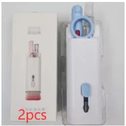 Multifunctional white cleaning pen kit open to show silicone tip, brush, keycap puller, and spray bottle for electronics.