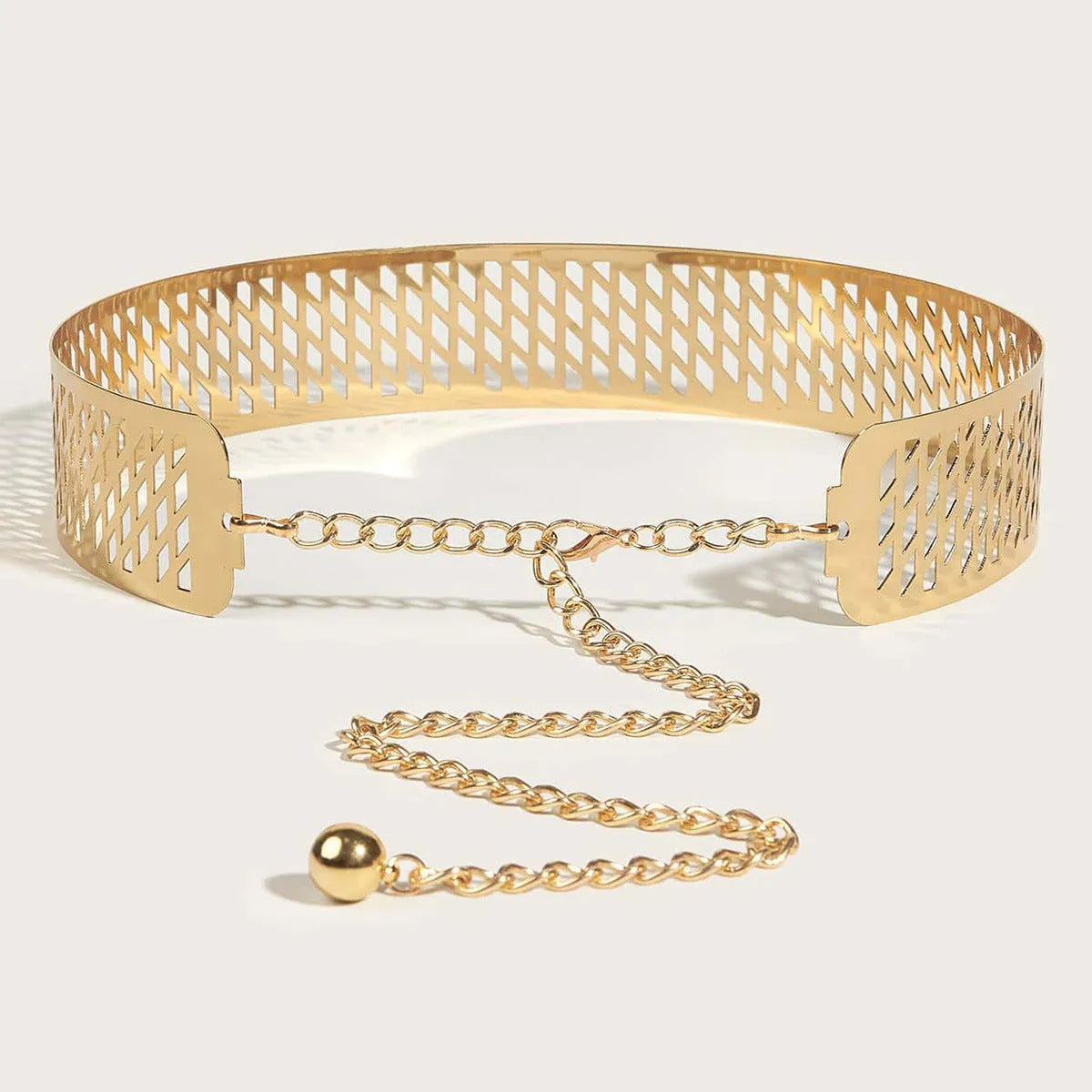 Golden waist belt with lantern floral punch design showing thick 4.5cm width and alloy buckle