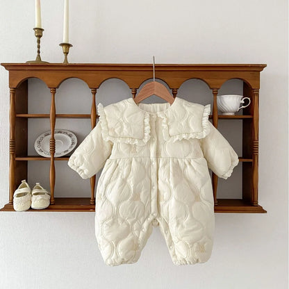 Newborn in light beige fleece-lined quilted cotton jumpsuit with single-breasted closure