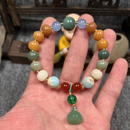White Bodhi root bracelet with carved pumpkin lotus beads including Apple Orchard and Duobao styles