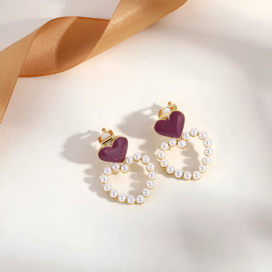 Geometric gold-tone tassel ear clips for non-pierced ears on a white background.