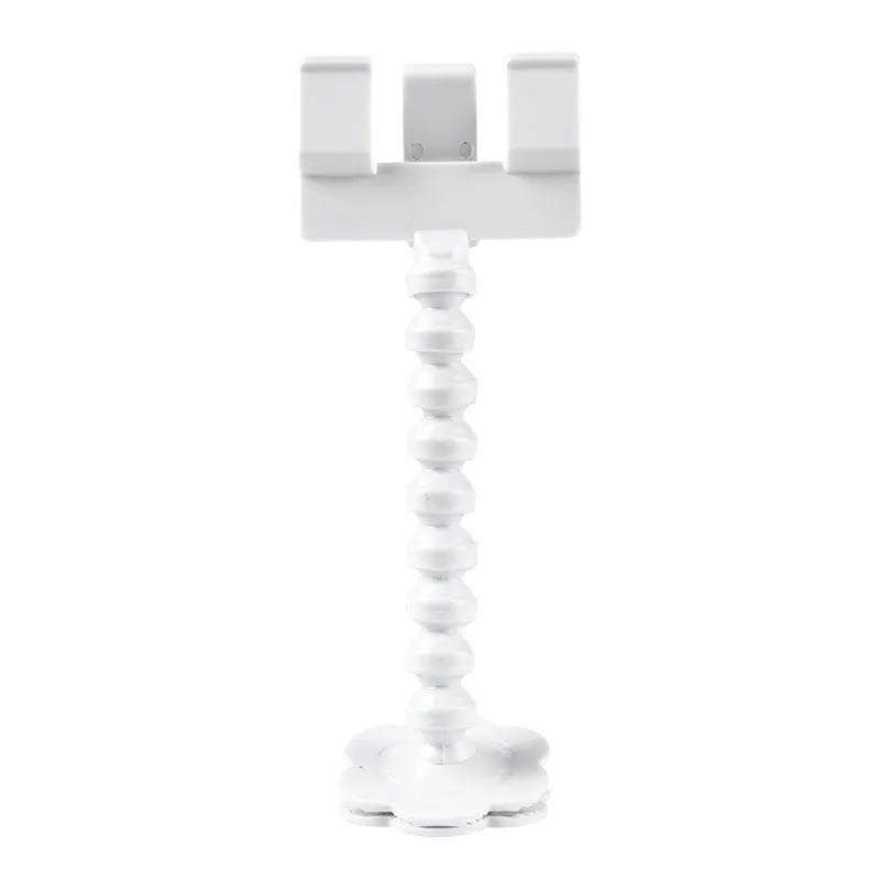 Black plastic pet photography tool attached to mobile phone with treat clip extended