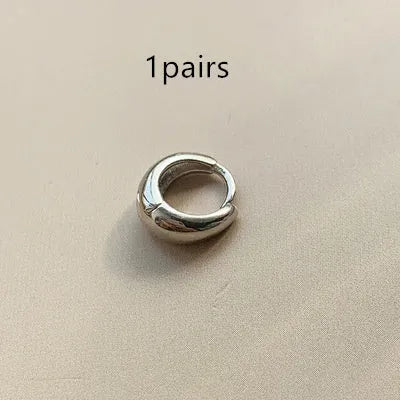 Women's retro minimalist water drop earrings in geometric round shape available in gold or silver colour with three size options