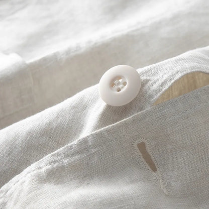 Men's loose fit linen suit jacket in solid colours showing long sleeves and casual styling