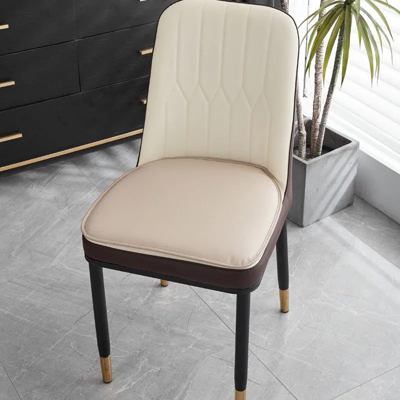 Leather horseshoe-shaped seat cushion in beige colour on a chair, showing non-slip base and 2.5cm thickness.