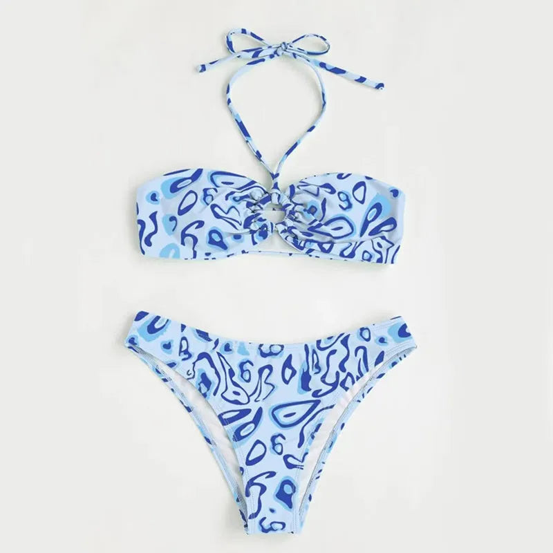 Blue floral pattern bandeau bikini swimsuit with backless design on mannequin