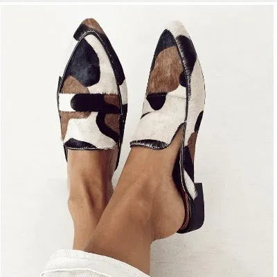 Women's black and white apricot retro pointed-toe shoes with imitation horsehair detail on suede upper and low rubber sole.