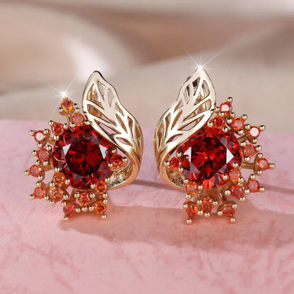 Round flower and feather design earrings in champagne gold with a choice of coloured zircon stones.