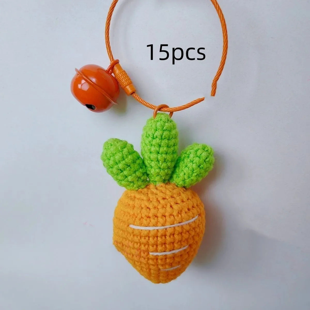 Cartoon carrot car design wool felt keychain pendant on a keyring.