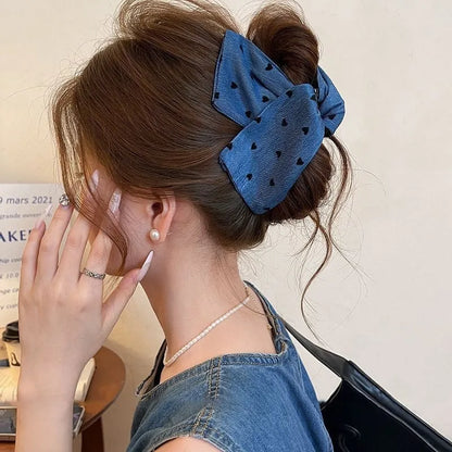Handmade fabric bow hair grip with triangle grip design and plastic hairpin